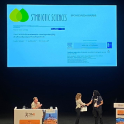 Jen McGaley receiving her award at ICOM 2024
