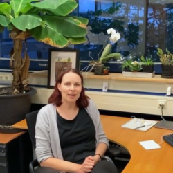 Kaisa Kajala sitting at her desk at Utrecht University