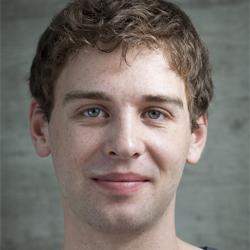 A man with curly light brown hair