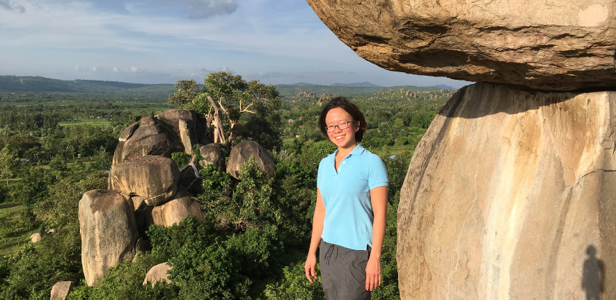 Trisna Tungadi on Kit Mikayi rock in Kenya when she worked with John Carr on a postdoctoral project in collaboration with bean growers in Kenya.